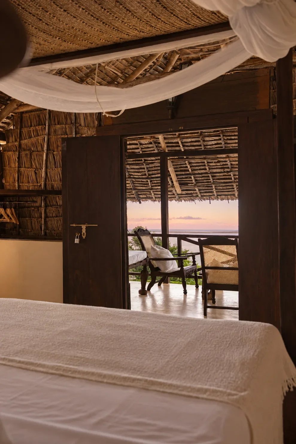 Makai first floor, from the bed through the open door to the verandah and the sea