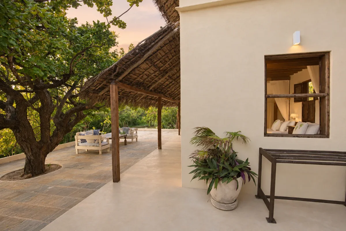 Mālama ground floor, the thatched verandah and stone terrace beside the bedroom window