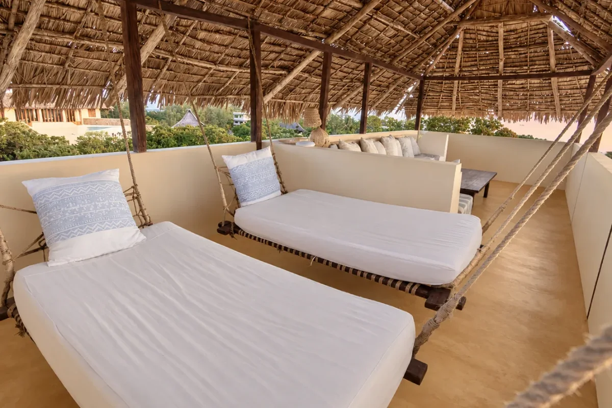 Mālama roof terrace, two hanging swing beds under the thatch