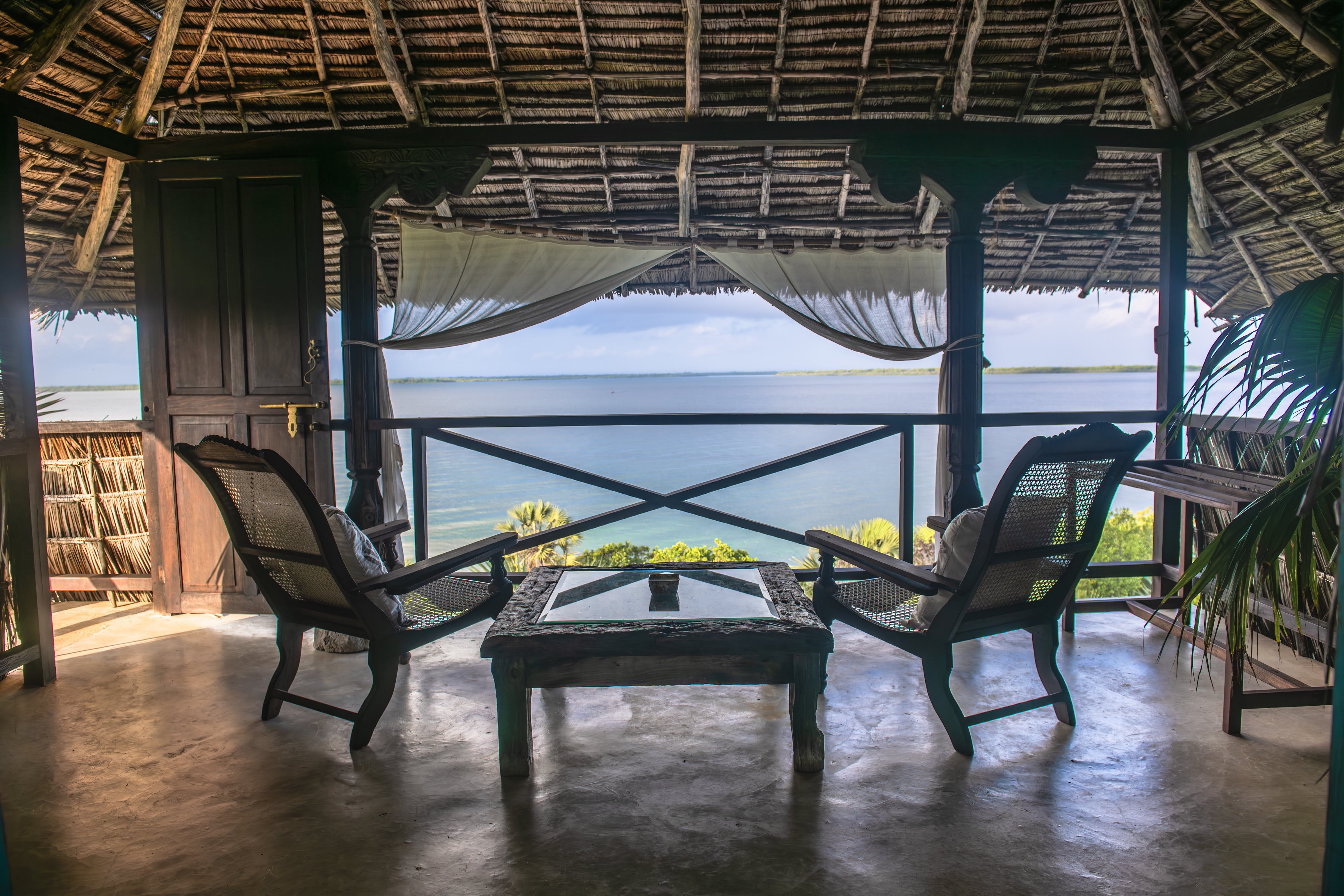 Moana cabana — blue Bali doors thrown open to the sea