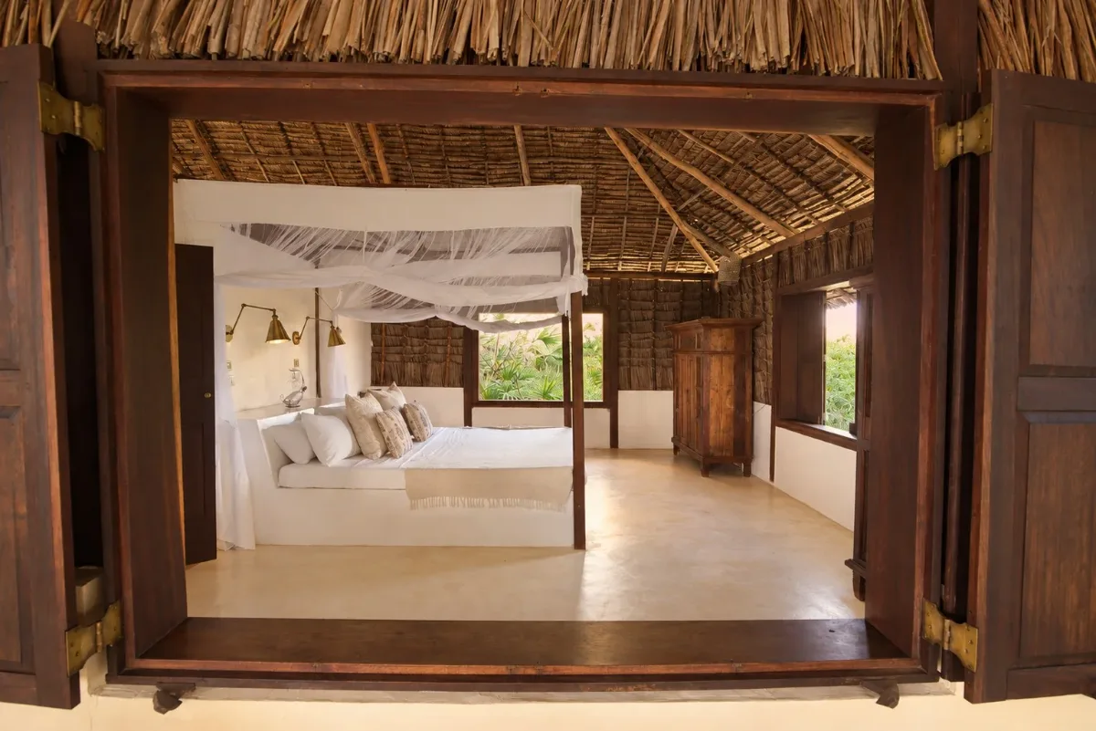 ʻOhana cabana, the double bedroom seen through open shutters